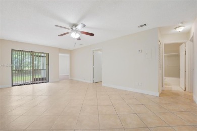 Immaculate, spacious  bright 2+/2 with extra room for use as 3rd on Woodmont Country Club in Florida - for sale on GolfHomes.com, golf home, golf lot