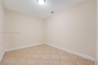 Immaculate, spacious  bright 2+/2 with extra room for use as 3rd on Woodmont Country Club in Florida - for sale on GolfHomes.com, golf home, golf lot