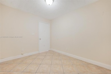 Immaculate, spacious  bright 2+/2 with extra room for use as 3rd on Woodmont Country Club in Florida - for sale on GolfHomes.com, golf home, golf lot