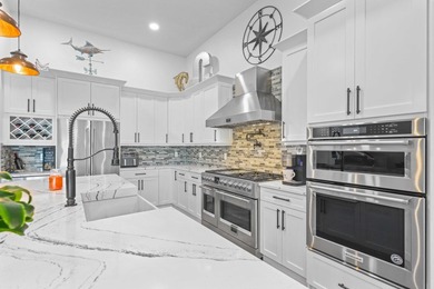 On one of the largest lots in Ancient Tree, this half-acre on Palm Beach Gardens Golf Course in Florida - for sale on GolfHomes.com, golf home, golf lot