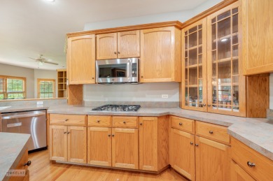 This exceptional ranch home combines timeless design with modern on Hughes Creek Golf Course in Illinois - for sale on GolfHomes.com, golf home, golf lot