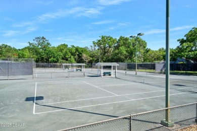 Discover effortless Florida living in this furnished villa on Halifax Plantation Golf Club in Florida - for sale on GolfHomes.com, golf home, golf lot