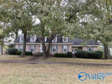 Two story brick home adjacent to Twin Lake golf course and pond on Twin Lakes Golf Course in Alabama - for sale on GolfHomes.com, golf home, golf lot