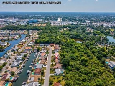 Live the Florida life in this waterfront community. Located in on Gulf Harbors Golf Course in Florida - for sale on GolfHomes.com, golf home, golf lot