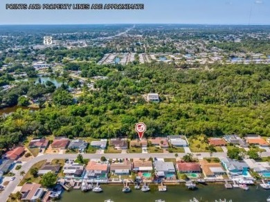 Live the Florida life in this waterfront community. Located in on Gulf Harbors Golf Course in Florida - for sale on GolfHomes.com, golf home, golf lot