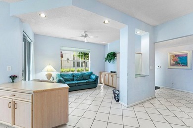 Inviting sun-splashed ground-floor condo with lovely golf and on Polo Club of Boca Raton in Florida - for sale on GolfHomes.com, golf home, golf lot