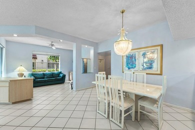 Inviting sun-splashed ground-floor condo with lovely golf and on Polo Club of Boca Raton in Florida - for sale on GolfHomes.com, golf home, golf lot