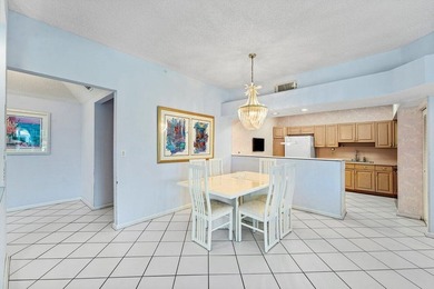 Inviting sun-splashed ground-floor condo with lovely golf and on Polo Club of Boca Raton in Florida - for sale on GolfHomes.com, golf home, golf lot