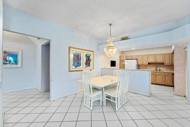 Inviting sun-splashed ground-floor condo with lovely golf and on Polo Club of Boca Raton in Florida - for sale on GolfHomes.com, golf home, golf lot