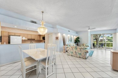 Inviting sun-splashed ground-floor condo with lovely golf and on Polo Club of Boca Raton in Florida - for sale on GolfHomes.com, golf home, golf lot