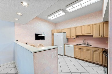 Inviting sun-splashed ground-floor condo with lovely golf and on Polo Club of Boca Raton in Florida - for sale on GolfHomes.com, golf home, golf lot