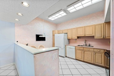 Inviting sun-splashed ground-floor condo with lovely golf and on Polo Club of Boca Raton in Florida - for sale on GolfHomes.com, golf home, golf lot