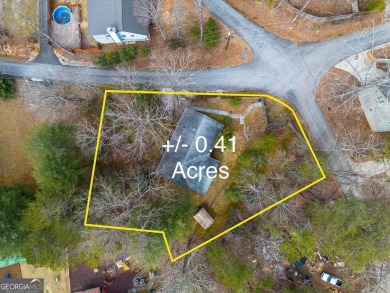 Nestled discreetly amid the pines, 9 Golf Drive, a corner lot on Rabun Golf Club in Georgia - for sale on GolfHomes.com, golf home, golf lot