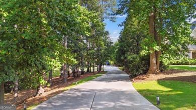 Privately tucked behind a long, tree-lined driveway and greeted on Chateau Elan Golf Club  in Georgia - for sale on GolfHomes.com, golf home, golf lot
