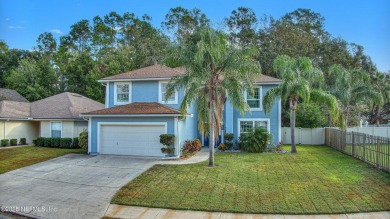 Welcome home to this two story charming home in the heart of on Golf Club At Fleming Island in Florida - for sale on GolfHomes.com, golf home, golf lot