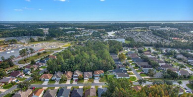 Welcome home to this two story charming home in the heart of on Golf Club At Fleming Island in Florida - for sale on GolfHomes.com, golf home, golf lot