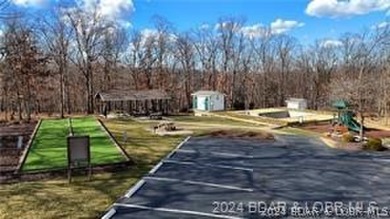 Looking to enjoy all the Lake of the Ozarks has to offer? Then on The Club At Porto Cima in Missouri - for sale on GolfHomes.com, golf home, golf lot