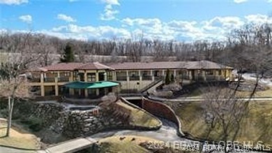 Looking to enjoy all the Lake of the Ozarks has to offer? Then on The Club At Porto Cima in Missouri - for sale on GolfHomes.com, golf home, golf lot