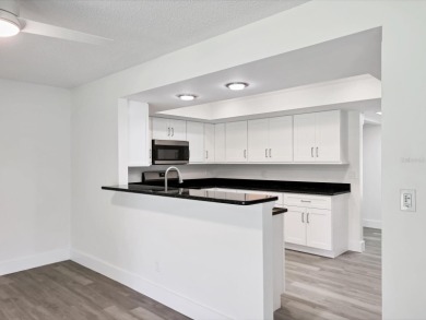 COMPLETELY UPDATED VILLA, LIGHT & BRIGHT, OPEN & AIRY TWO on Palm Aire Country Club of Sarasota in Florida - for sale on GolfHomes.com, golf home, golf lot