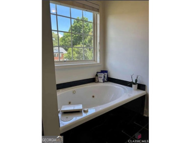 Enjoy life in this beautiful all-brick, low maintenance home in on Jennings Mill Country Club in Georgia - for sale on GolfHomes.com, golf home, golf lot
