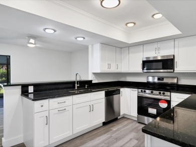 COMPLETELY UPDATED VILLA, LIGHT & BRIGHT, OPEN & AIRY TWO on Palm Aire Country Club of Sarasota in Florida - for sale on GolfHomes.com, golf home, golf lot