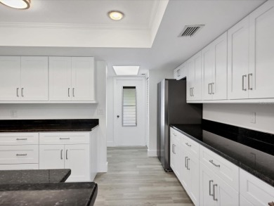 COMPLETELY UPDATED VILLA, LIGHT & BRIGHT, OPEN & AIRY TWO on Palm Aire Country Club of Sarasota in Florida - for sale on GolfHomes.com, golf home, golf lot