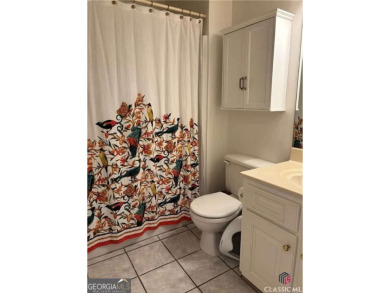 Enjoy life in this beautiful all-brick, low maintenance home in on Jennings Mill Country Club in Georgia - for sale on GolfHomes.com, golf home, golf lot