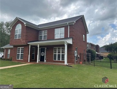 Enjoy life in this beautiful all-brick, low maintenance home in on Jennings Mill Country Club in Georgia - for sale on GolfHomes.com, golf home, golf lot