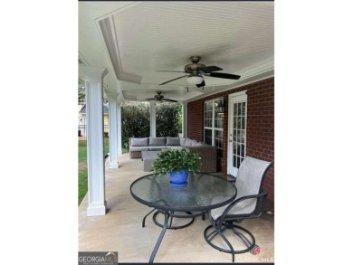 Enjoy life in this beautiful all-brick, low maintenance home in on Jennings Mill Country Club in Georgia - for sale on GolfHomes.com, golf home, golf lot