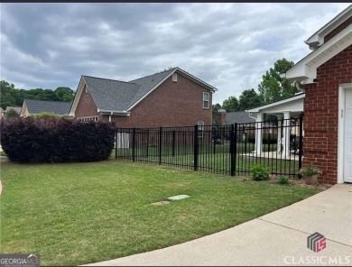 Enjoy life in this beautiful all-brick, low maintenance home in on Jennings Mill Country Club in Georgia - for sale on GolfHomes.com, golf home, golf lot