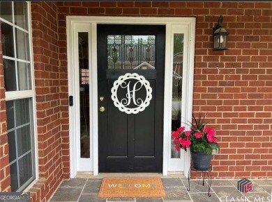 Enjoy life in this beautiful all-brick, low maintenance home in on Jennings Mill Country Club in Georgia - for sale on GolfHomes.com, golf home, golf lot