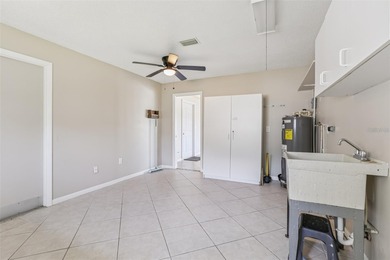 Updated and move in ready concrete block house on lake with on North Lakes Golf Course in Florida - for sale on GolfHomes.com, golf home, golf lot