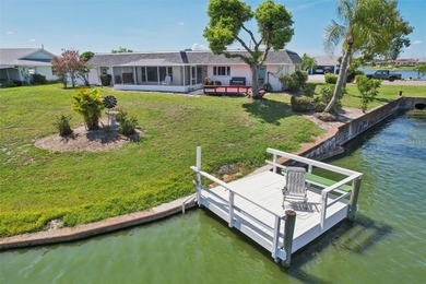 Updated and move in ready concrete block house on lake with on North Lakes Golf Course in Florida - for sale on GolfHomes.com, golf home, golf lot