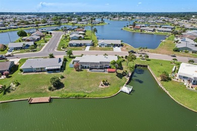 Updated and move in ready concrete block house on lake with on North Lakes Golf Course in Florida - for sale on GolfHomes.com, golf home, golf lot