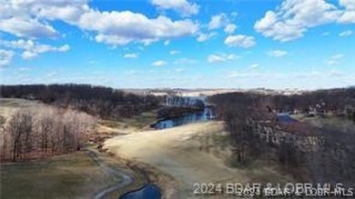 Looking to enjoy all the Lake of the Ozarks has to offer? Then on The Club At Porto Cima in Missouri - for sale on GolfHomes.com, golf home, golf lot