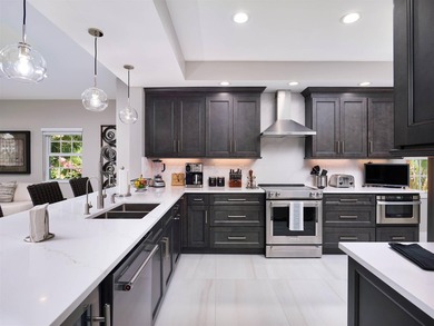 Fully renovated in 2024, this stunning first-floor end-unit on PGA National Golf Club in Florida - for sale on GolfHomes.com, golf home, golf lot