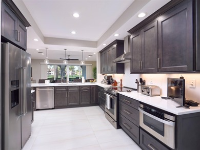 Fully renovated in 2024, this stunning first-floor end-unit on PGA National Golf Club in Florida - for sale on GolfHomes.com, golf home, golf lot
