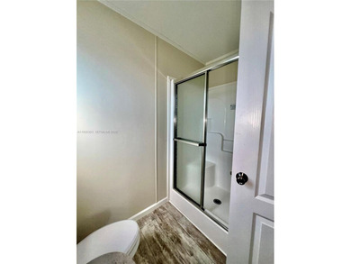 WOW! BRAND-NEW 2025 DOUBLE-WIDE MANUFACTURED HOME -- YOU OWN THE on The Club at Emerald Hills in Florida - for sale on GolfHomes.com, golf home, golf lot