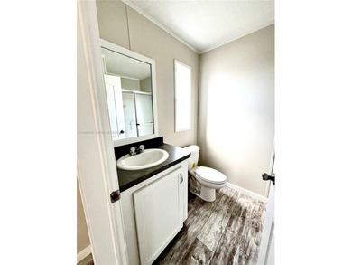 WOW! BRAND-NEW 2025 DOUBLE-WIDE MANUFACTURED HOME -- YOU OWN THE on The Club at Emerald Hills in Florida - for sale on GolfHomes.com, golf home, golf lot