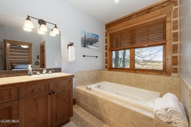 This stunning mountain retreat offers a perfect blend of rustic on Grand Elk Ranch and Club in Colorado - for sale on GolfHomes.com, golf home, golf lot