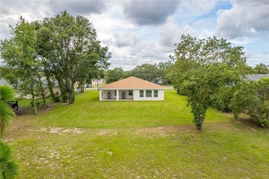 Welcome to this one-of-a-kind, newly built home in the heart of on Oak Hills Country Club in Florida - for sale on GolfHomes.com, golf home, golf lot