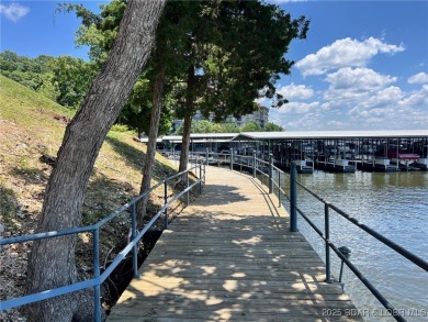 A phenomenal main channel view from the minute you walk in this on Tan-Tar-A Golf Club in Missouri - for sale on GolfHomes.com, golf home, golf lot