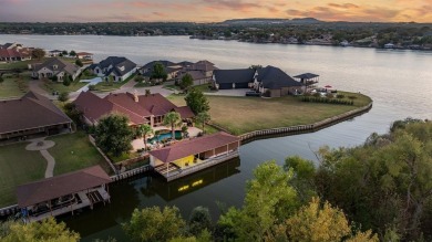 Stunning waterfront home in the coveted community of The Island on Harbor Lakes Golf Club in Texas - for sale on GolfHomes.com, golf home, golf lot