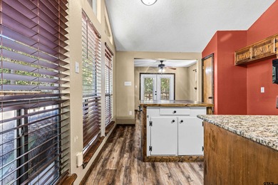 Welcome home to a warm and inviting retreat tucked away among on Holly Lake Ranch Golf Club in Texas - for sale on GolfHomes.com, golf home, golf lot