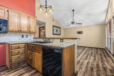 Welcome home to a warm and inviting retreat tucked away among on Holly Lake Ranch Golf Club in Texas - for sale on GolfHomes.com, golf home, golf lot