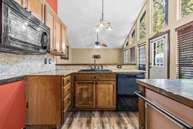 Welcome home to a warm and inviting retreat tucked away among on Holly Lake Ranch Golf Club in Texas - for sale on GolfHomes.com, golf home, golf lot