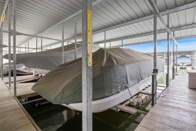 Welcome to this top floor waterfront condo with breathtaking on The Club At Old Kinderhook in Missouri - for sale on GolfHomes.com, golf home, golf lot