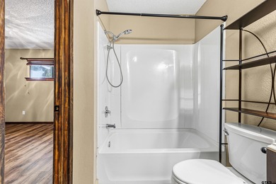 Welcome home to a warm and inviting retreat tucked away among on Holly Lake Ranch Golf Club in Texas - for sale on GolfHomes.com, golf home, golf lot