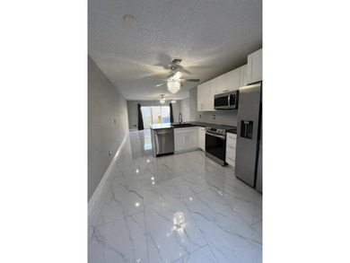 Welcome home! Fully renovated luxury patio home stands far above on Poinciana Golf Club in Florida - for sale on GolfHomes.com, golf home, golf lot