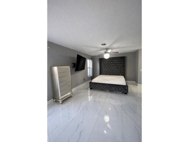 Welcome home! Fully renovated luxury patio home stands far above on Poinciana Golf Club in Florida - for sale on GolfHomes.com, golf home, golf lot